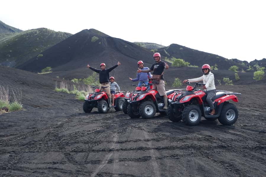 Bali: Mount Batur Quad Bike Tour and Natural Hot Springs - Riding beneath Mount Batur on black volcanic sand
