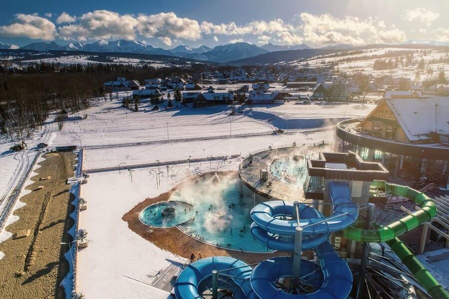 From Krakow: Snowmobile adventure and Thermal Baths tour - Chochołów and its wooden cottages