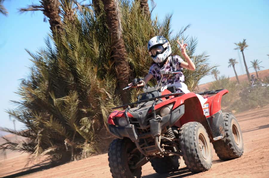 From Marrakech: Camel Ride, Quad Bike & Spa Full-Day Trip - Quad biking on dusty Palmeraie tracks