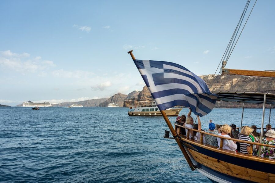 Santorini: Volcanic Islands Cruise with Hot Springs Visit - Sailing beneath Santorini’s cliffs